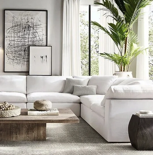 Close-up keyholes with curtains and a handle on the gray many times painted cracked double-barreled wooden vintage door of the last century with a post slit.